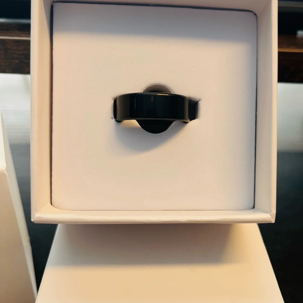 Black Smart Ring - size 8. Comes With Instructions and Charging Cord.